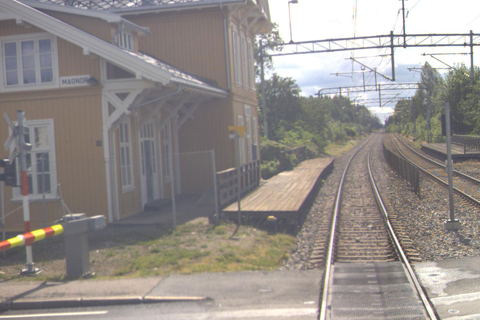 Tracks and station building at Magnor station