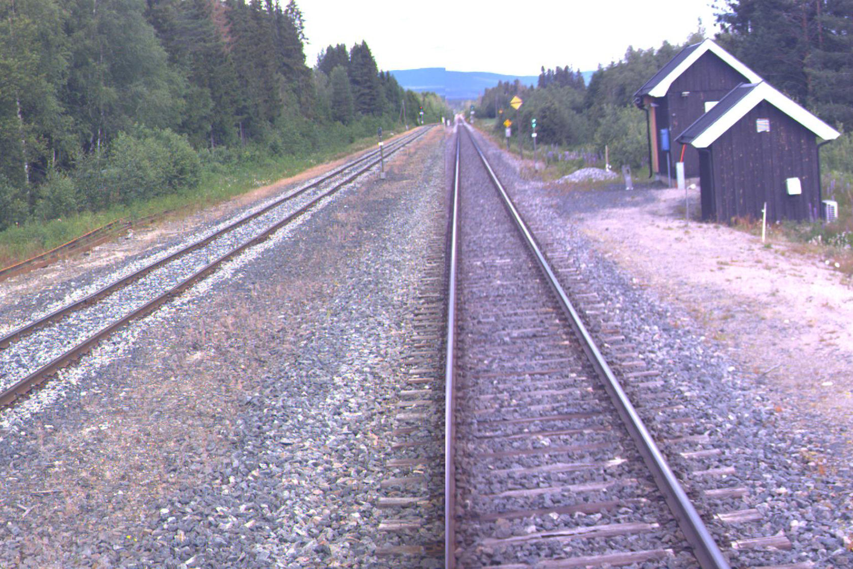 Tracks and buildings at Rudstad station